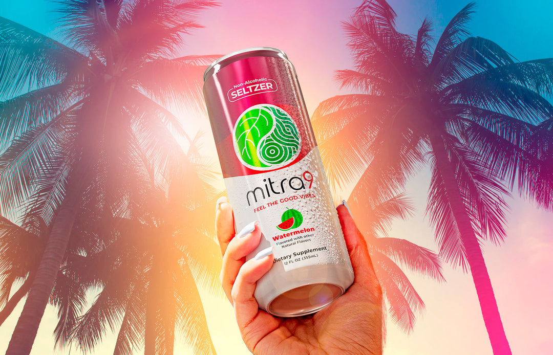 Hand Holding Non Alcoholic Drink in Florida Palm Trees