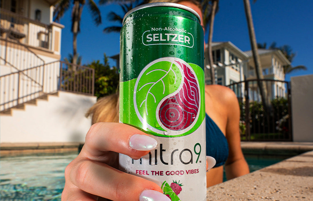 Green non-alcoholic drink woman swimming in pool