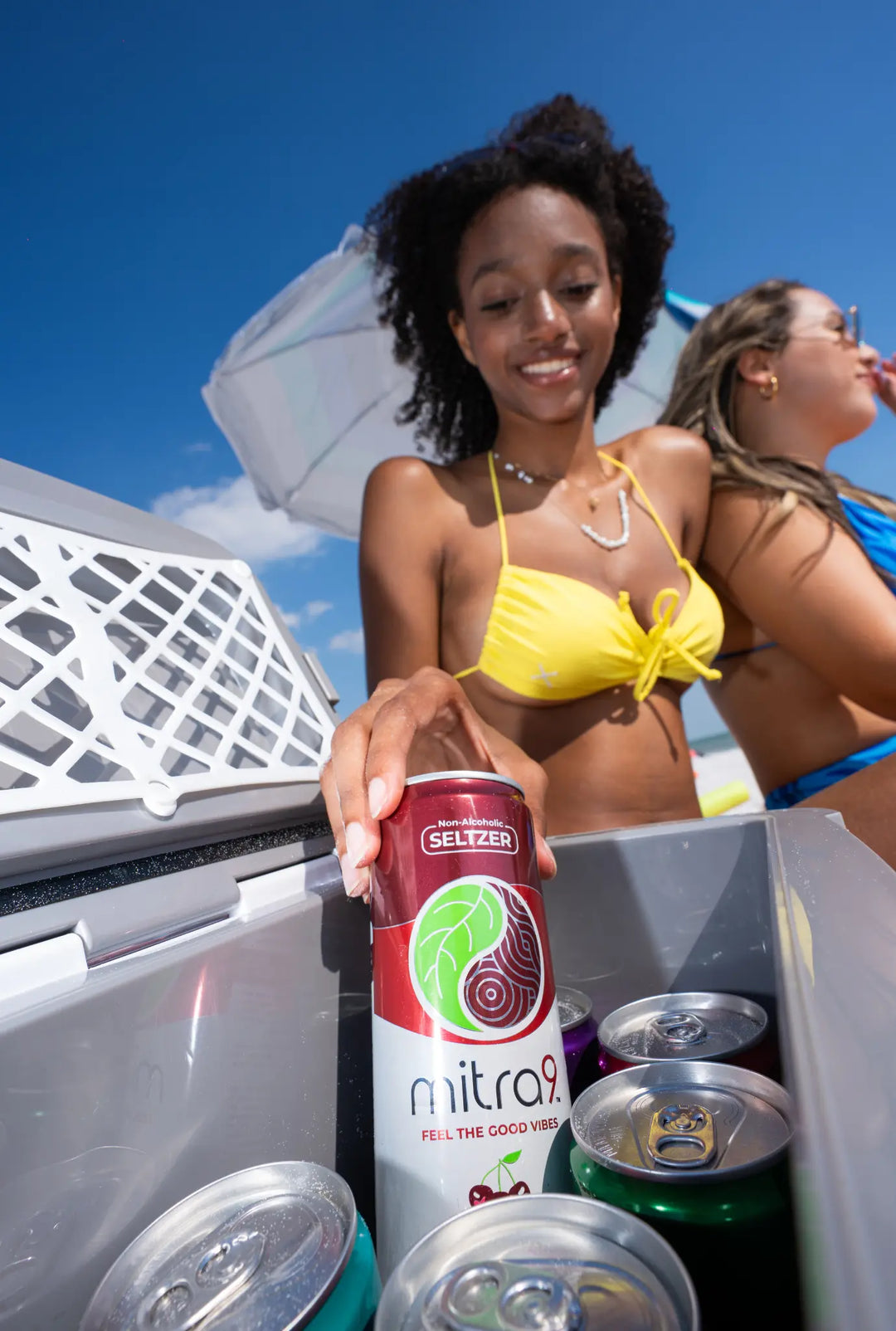 Model in Yellow Bikini Reaching in Cooler for a Ice Cold Kratom Drink