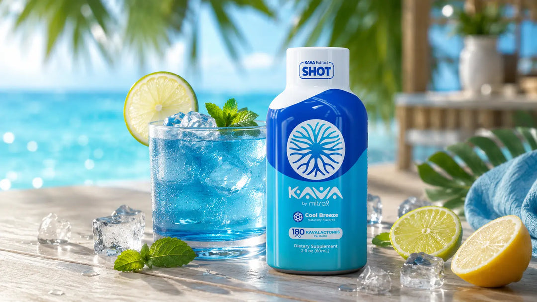 Kava by Mitra9 Cool Breeze Kava Shot with a chilled blue citrus drink, fresh lime, mint, and ice in a tropical setting.