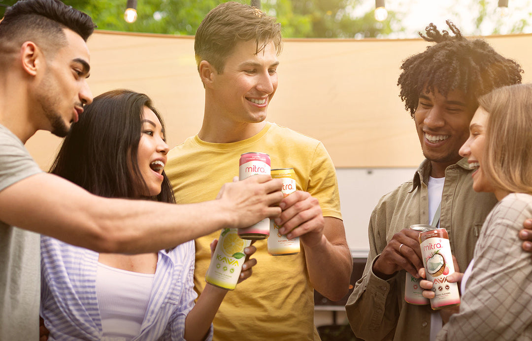 Friends Laughing Enjoying Mitra9 Drinks Fall-Time Outdoors