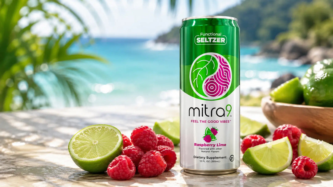 Mitra9 Raspberry Lime functional seltzer can displayed with fresh raspberries and lime wedges in a tropical beach setting.