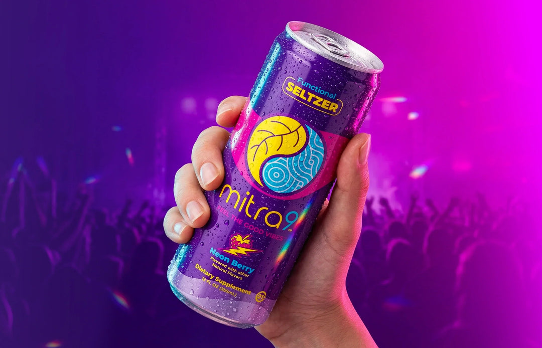 Mitra9 Neon Berry Mitragynine functional seltzer held at concert, non-alcoholic alternative drink with refreshing berry flavor, botanical soda for social occasions
