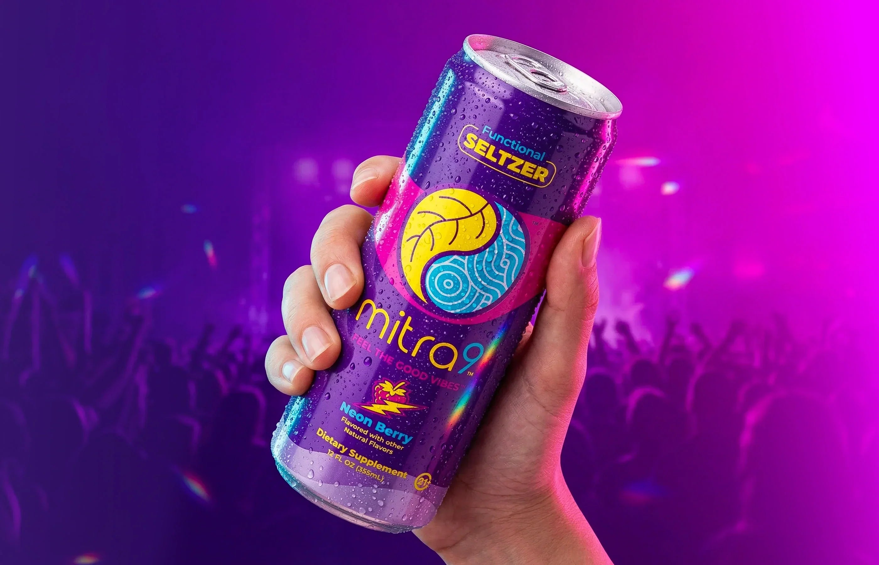 Mitra9 Neon Berry Mitragynine functional seltzer held at concert, non-alcoholic alternative drink with refreshing berry flavor, botanical soda for social occasions