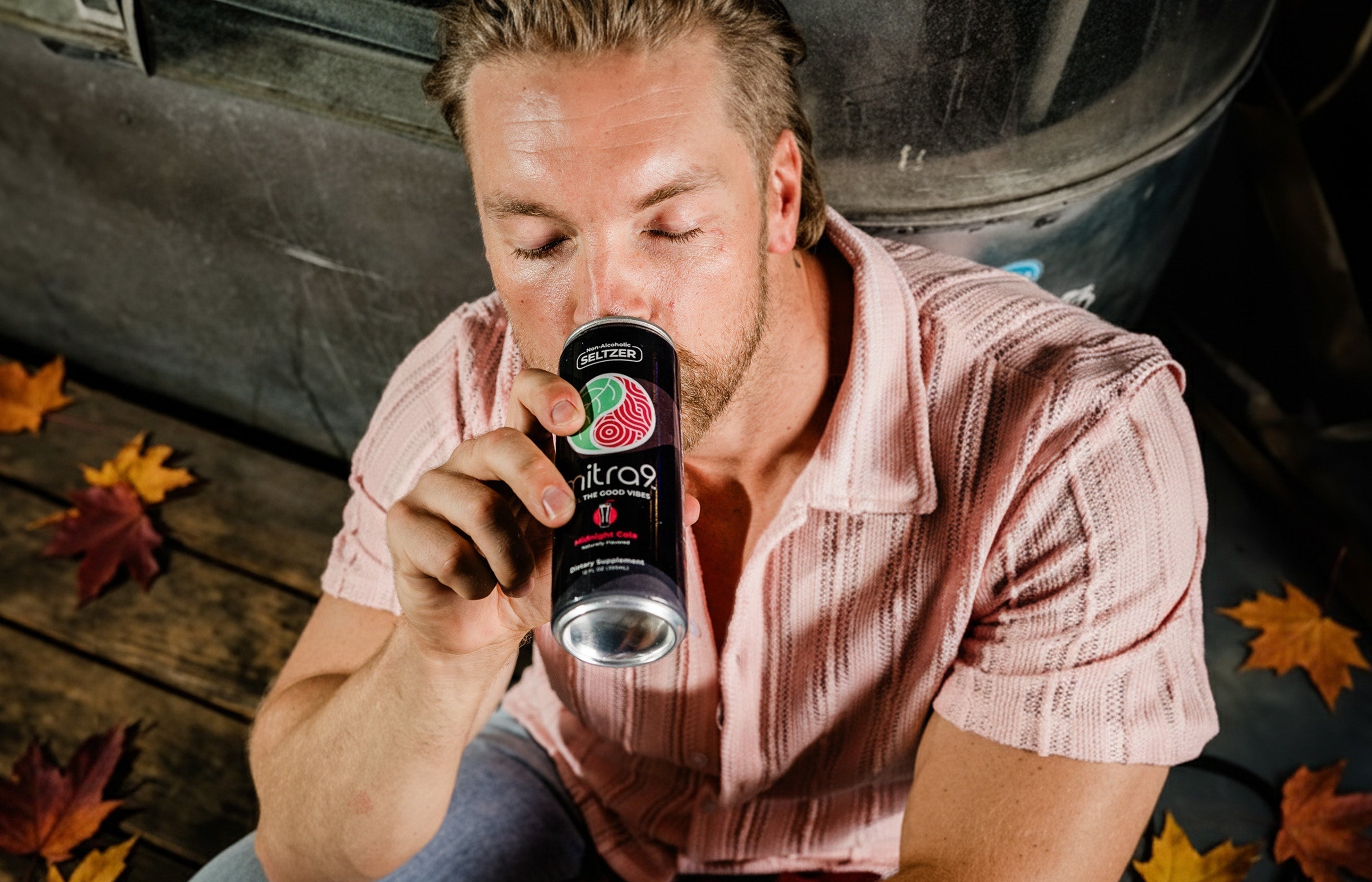 Man sitting drinking functional beverage during the fall