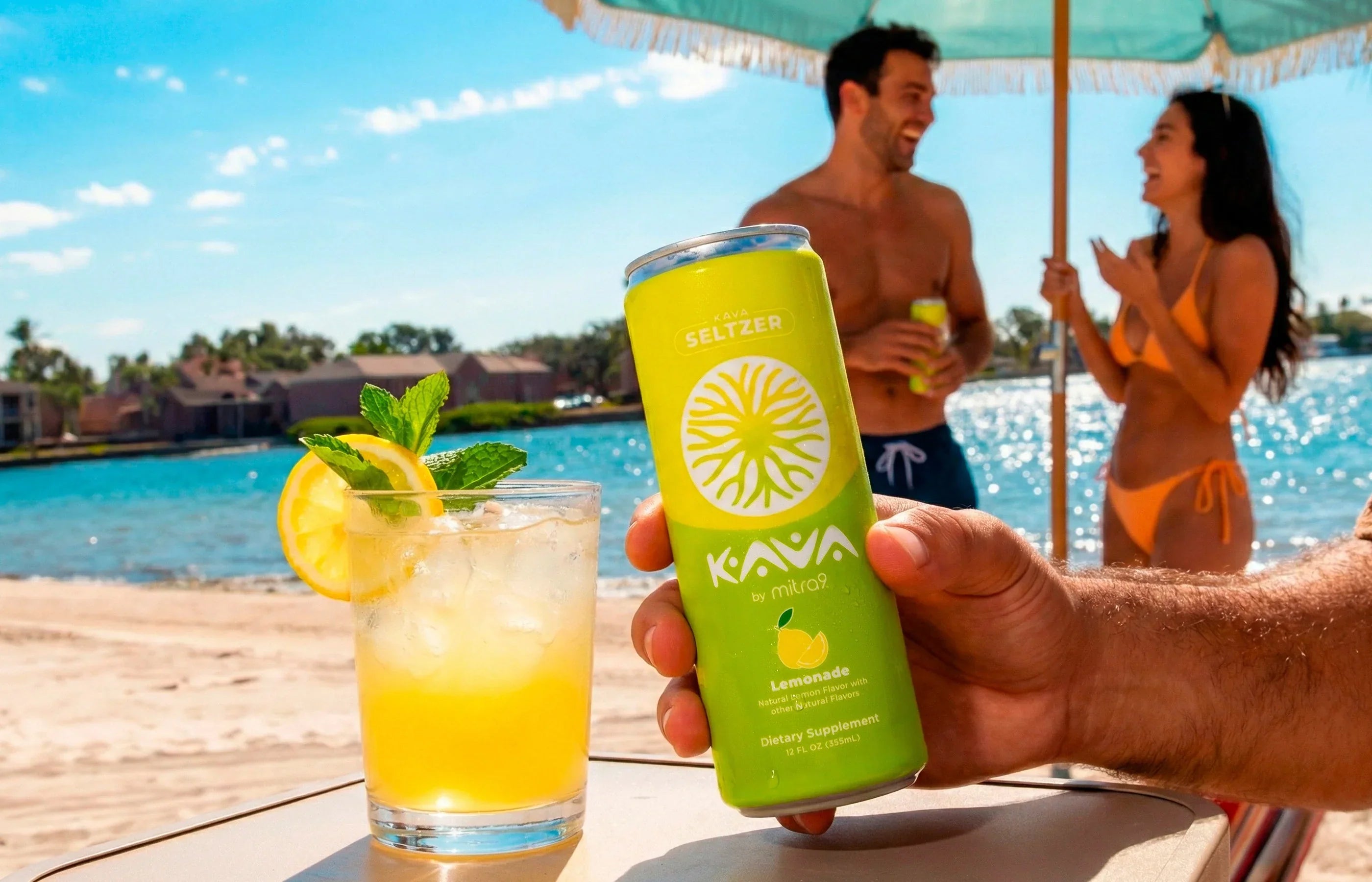 Hand holding a Kava seltzer lemonade can next to a refreshing citrus drink by the pool with people relaxing in the background, showcasing a non-alcoholic functional beverage that tastes like alcohol without the buzz