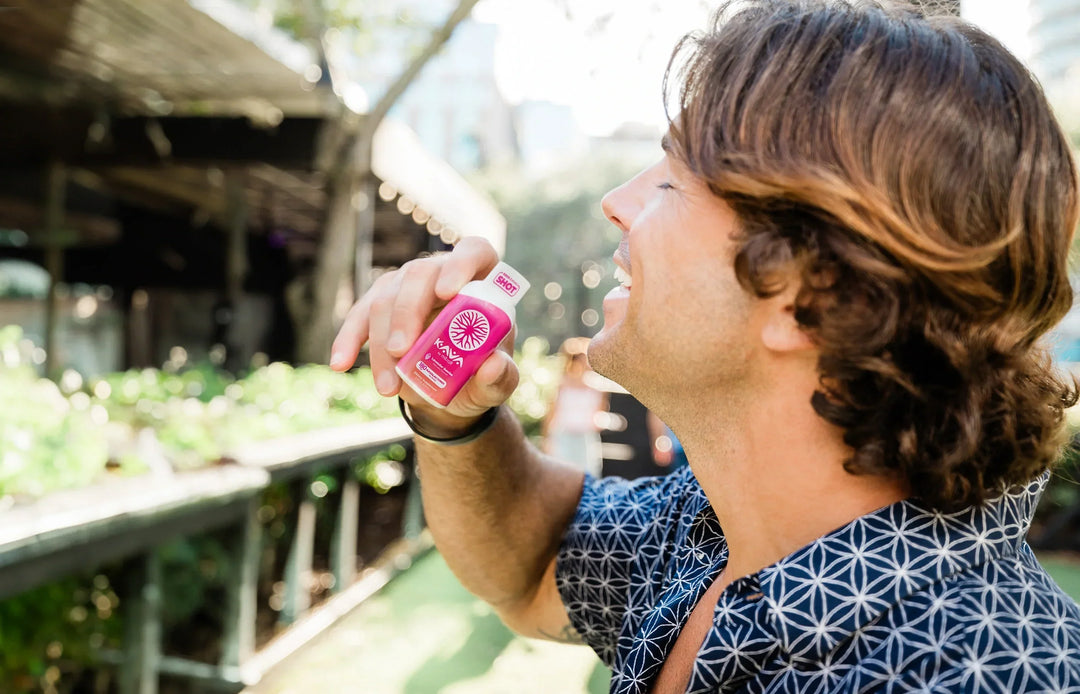 Man drinking a Mitra9 Kava Shot outdoors, representing the calming effects of Kava for stress and anxiety relief