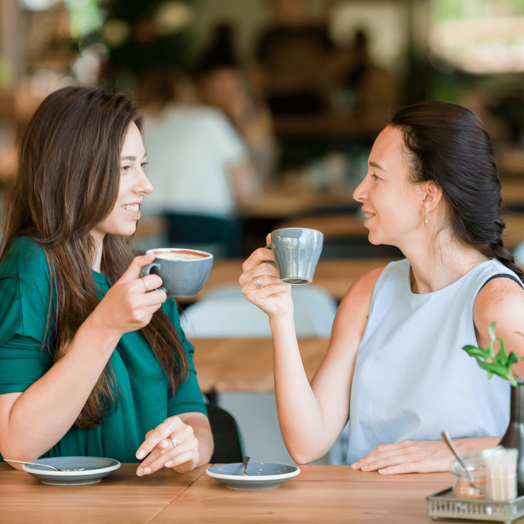 Two women drinking kava at a kava bar