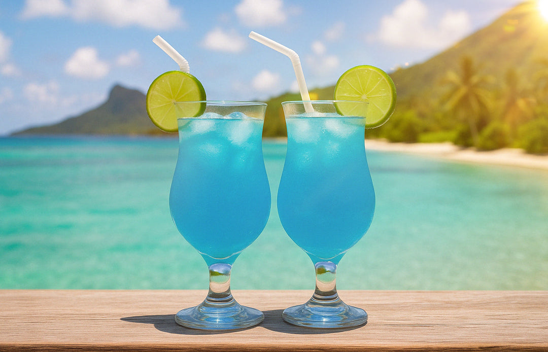 Non alcoholic blue mocktail drinks with lime oceanside